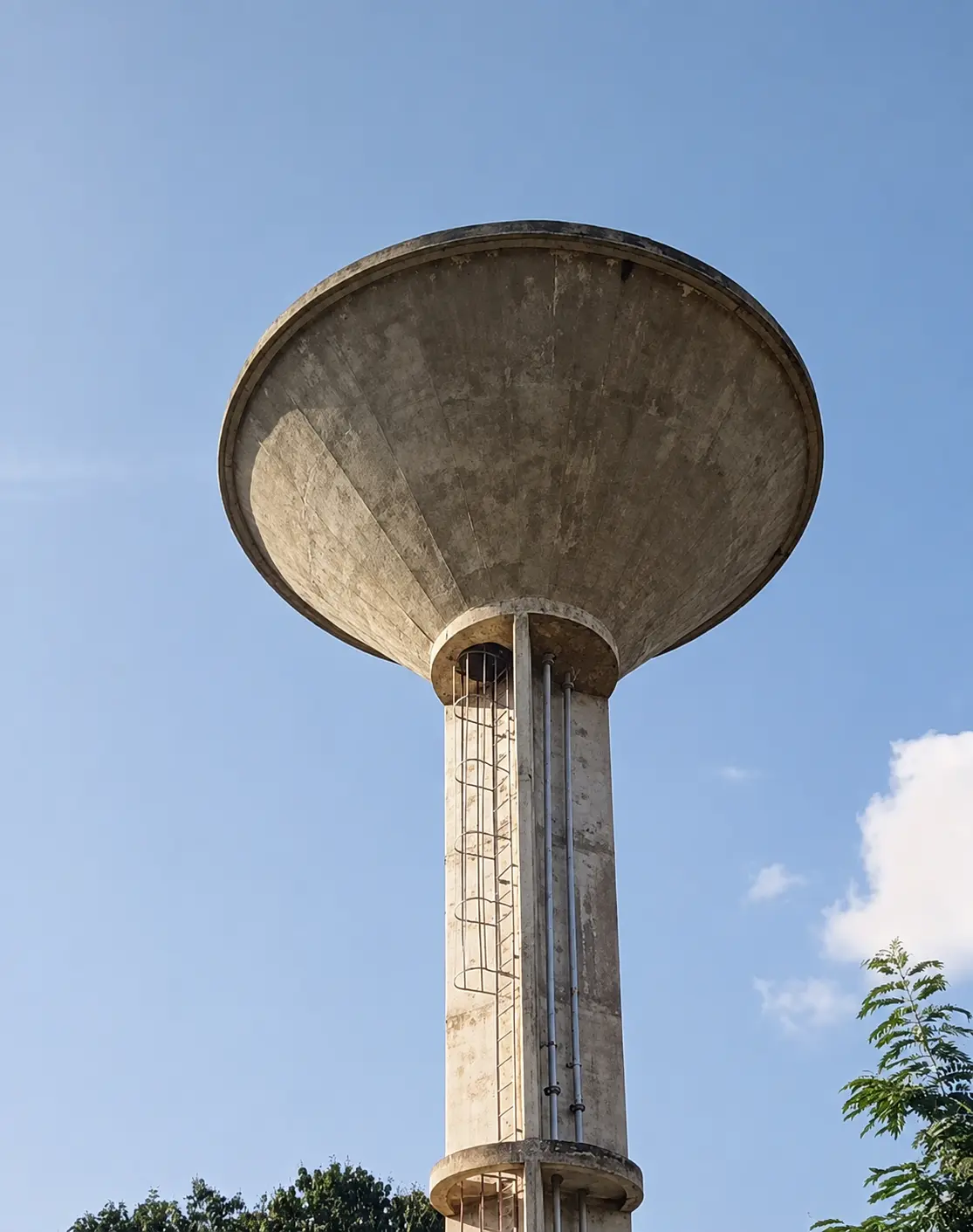 An elevated water storage tower serving a rural community