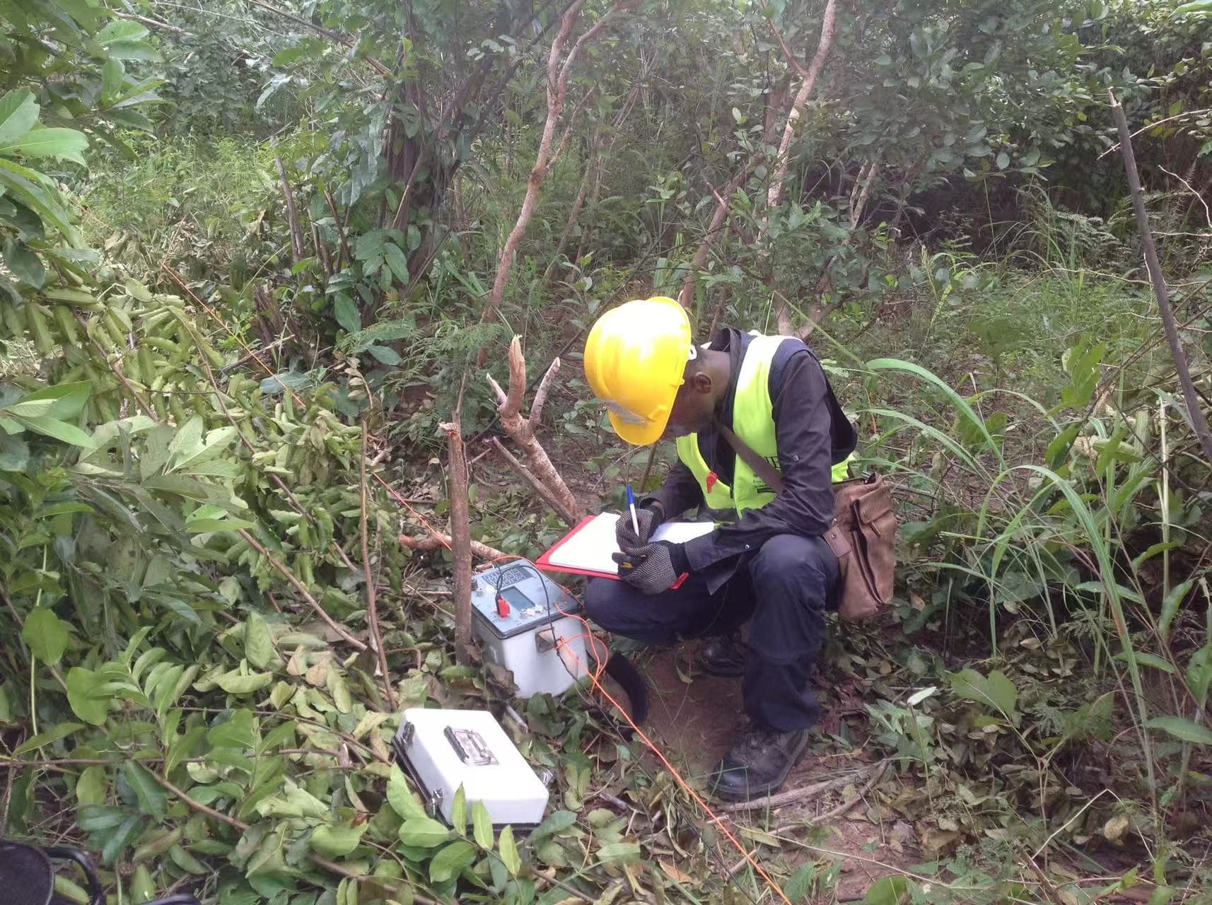 Field technicians acquiring geophysical evidence along a survey line